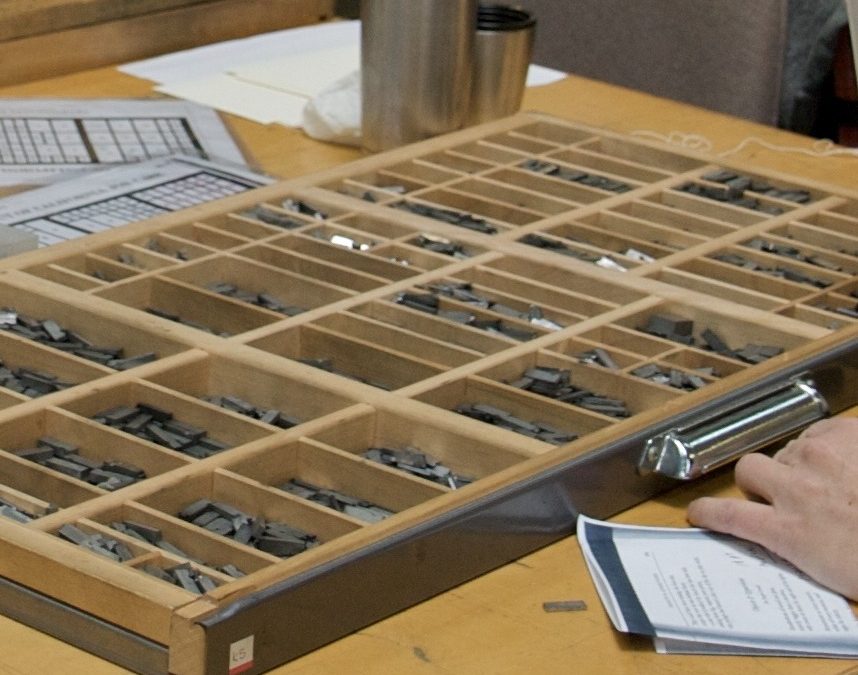 Hand sorting metal type sorts into a letterpress job case