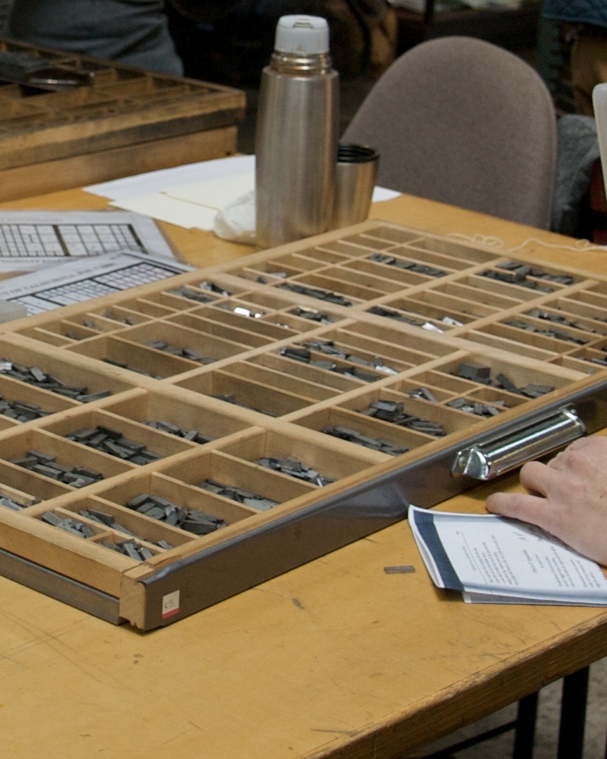 Hand sorting metal type sorts into a letterpress job case