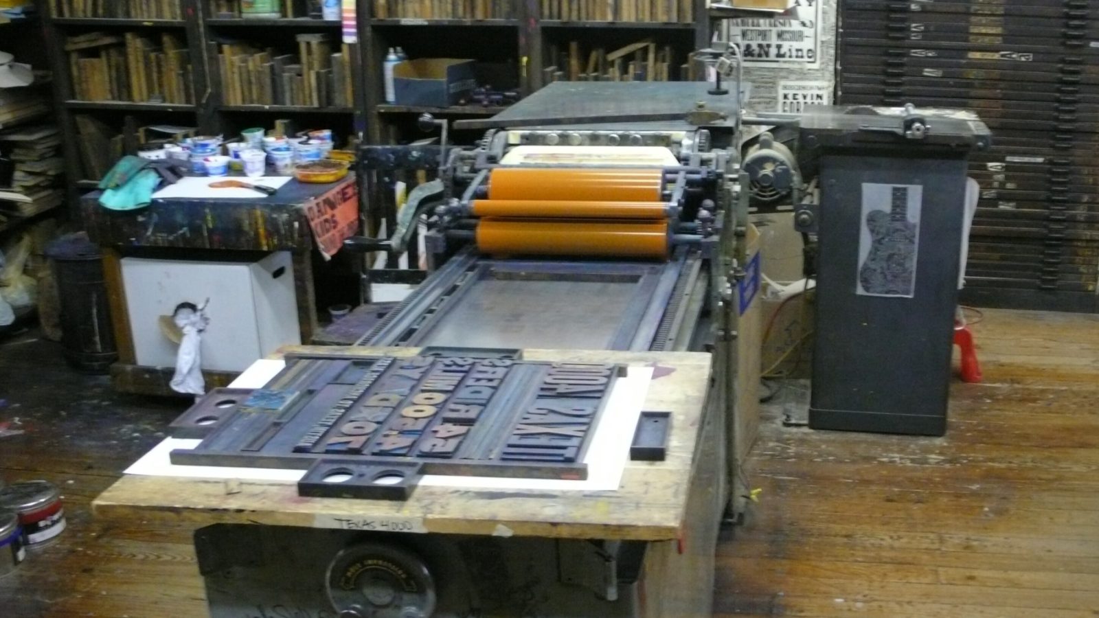 Letterpress platen press loaded with locked type, ready to print