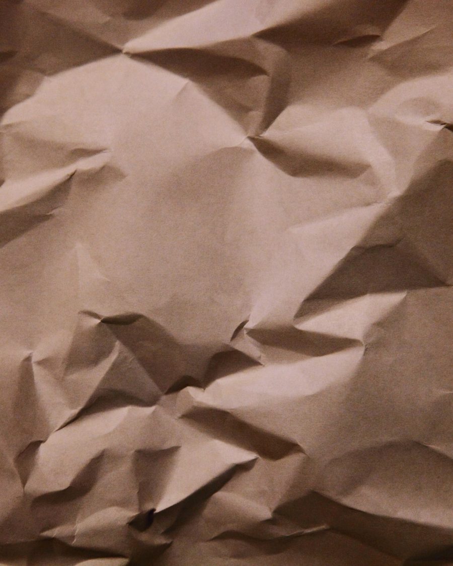 Warm kraft-toned paper with visible fiber texture