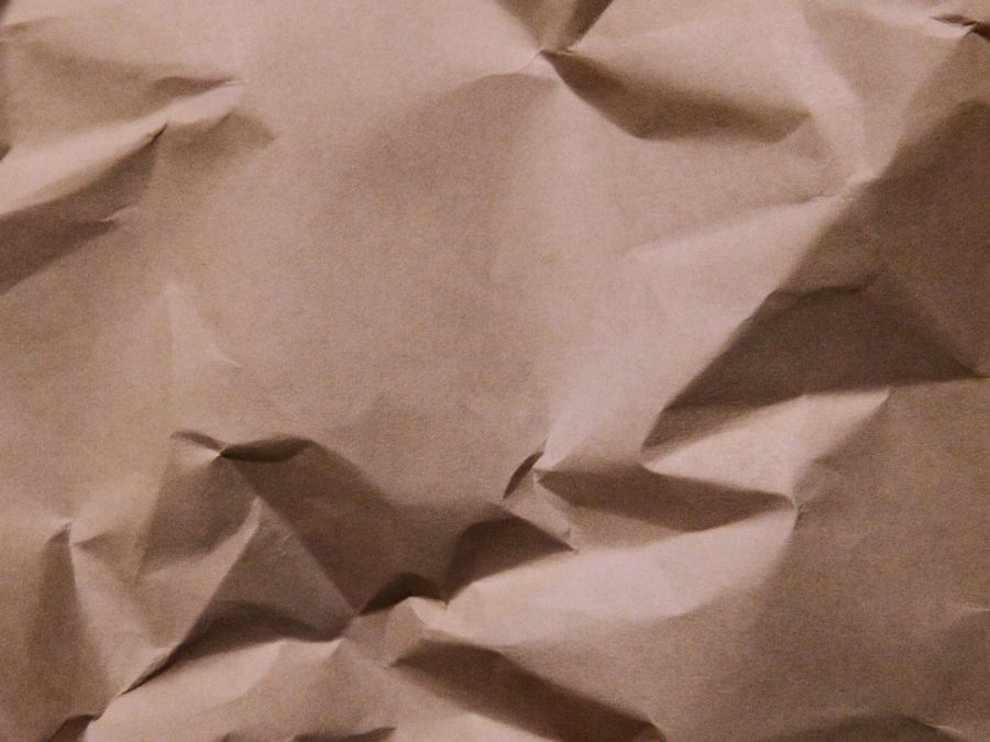 Warm kraft-toned paper with visible fiber texture