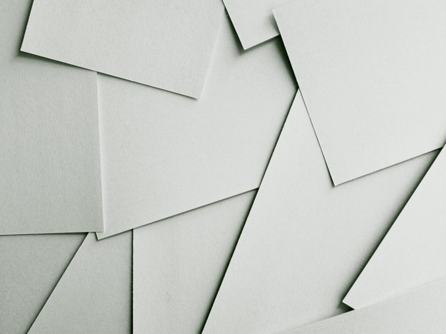Stack of soft-white eggshell-finish paper sheets